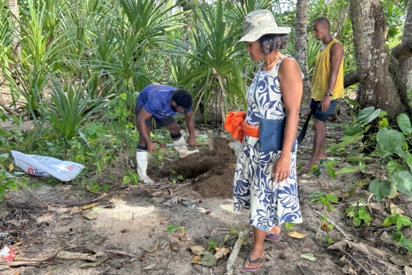 Pelasio Raibia (in blue) doing coastal tree replanting. Photo credit: Setaita Tavanabola & Manasa Vula